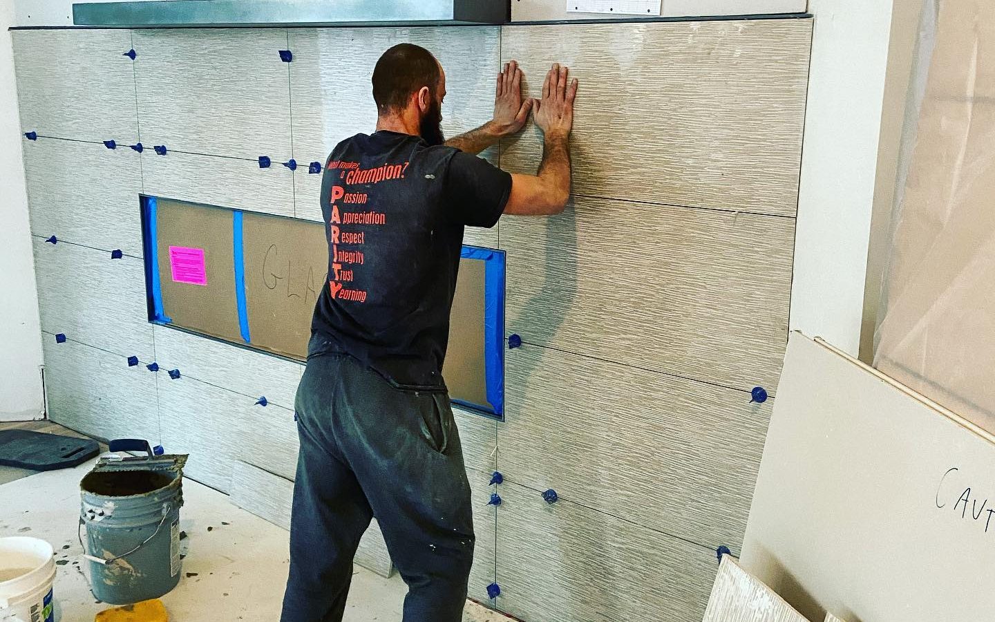 Eldan Hamzic setting large-format wall tile
